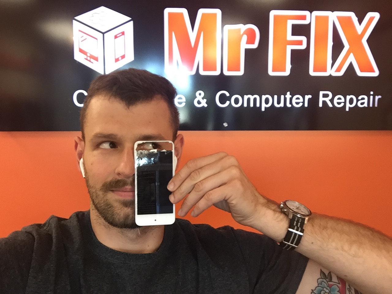 Our CEO Denys is looking through iPod Touch screen